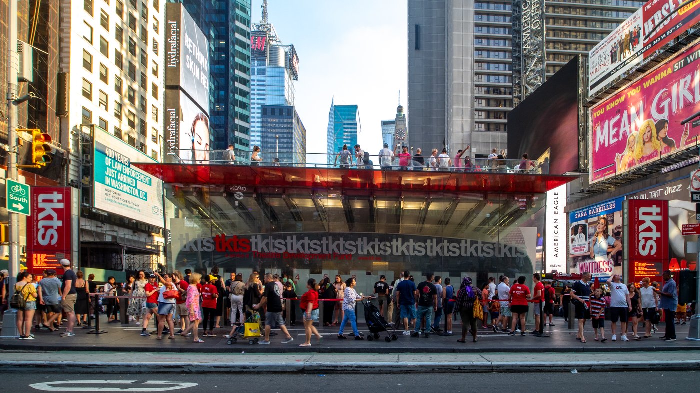 TKTS booth in Times Square with red glass stairs