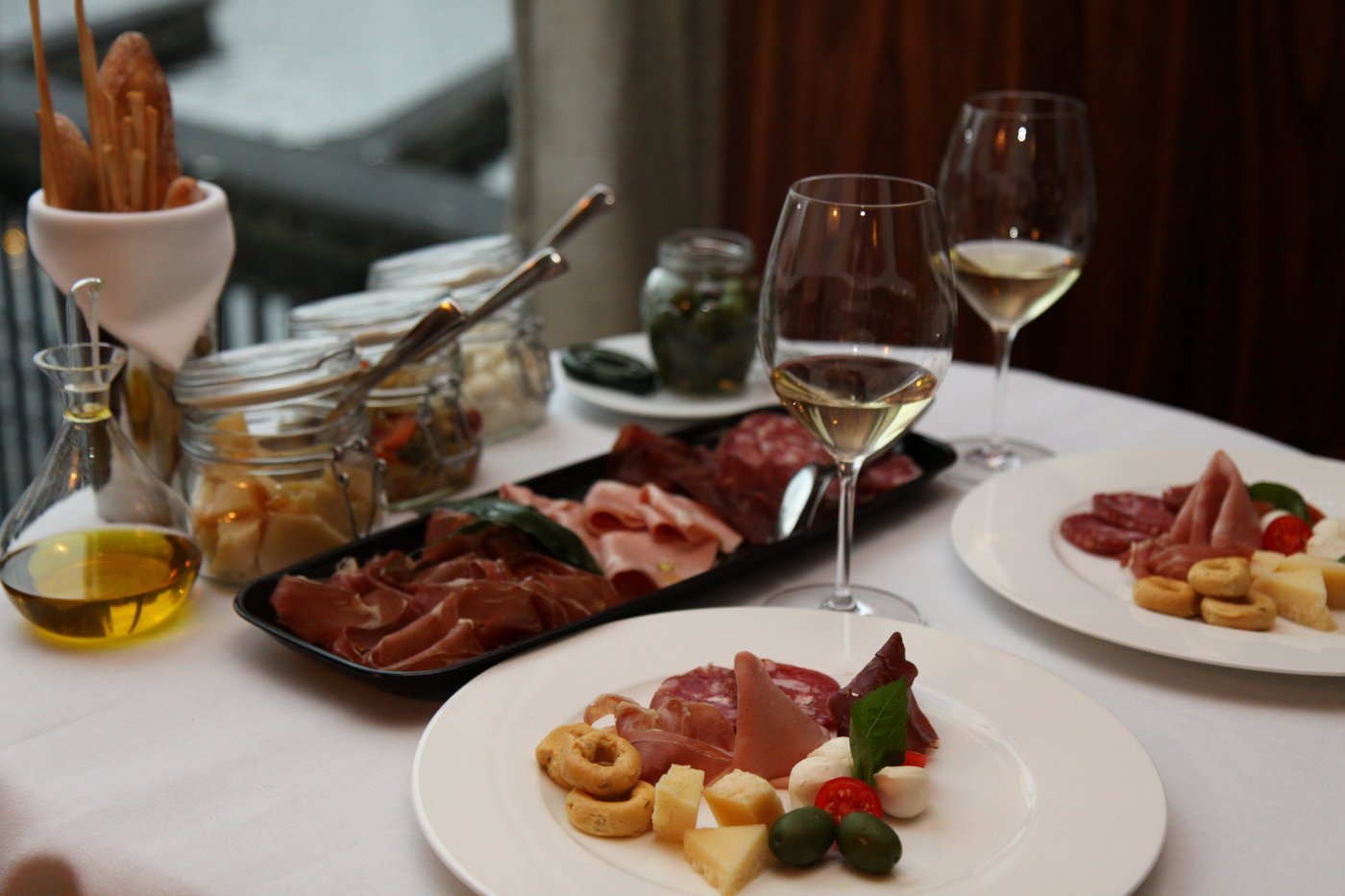 An Italian antipasto spread with cured meats, cheeses, and vegetables